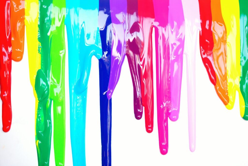 pexels-photo-1212407-1212407 Bright, colorful paints dripping creating a rainbow effect on a white background, symbolizing diversity and creativity.